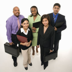 Portrait of multi-ethnic business group standing and holding a briefcases